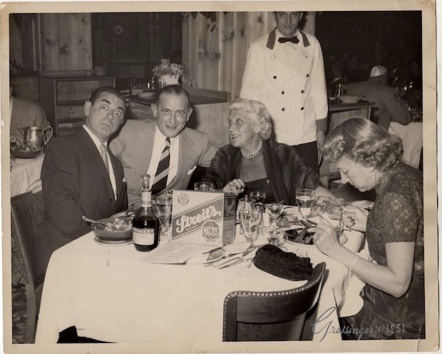 Irving and wife Mary Streit at Grossingerâs in the Catskills with comedian Eddie Cantor, Streitâs Matzos on the table, 1951